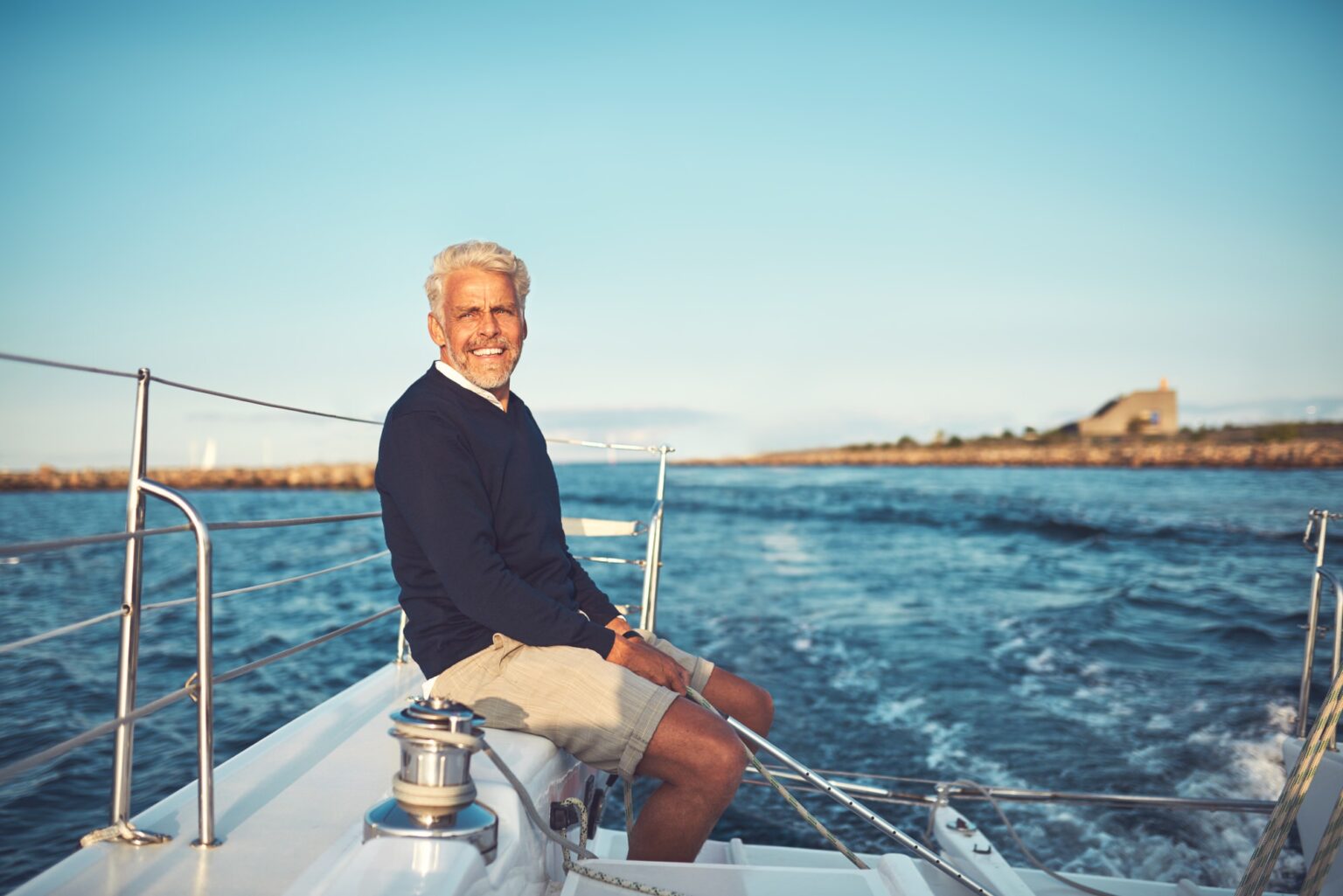 European Boat Transport - Mature man enjoying a day sailing on the ocean